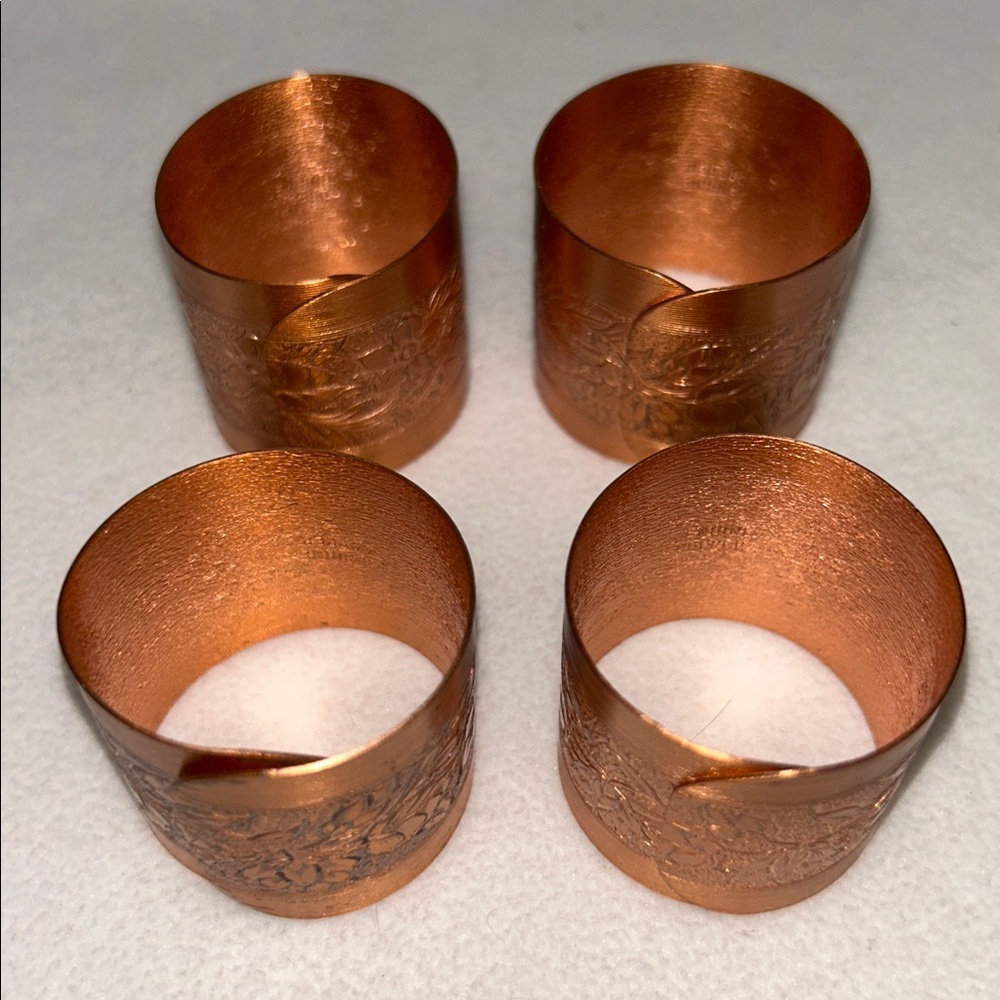 Vintage 70s set of 4 embossed copper napkin rings by Copper Craft Guild